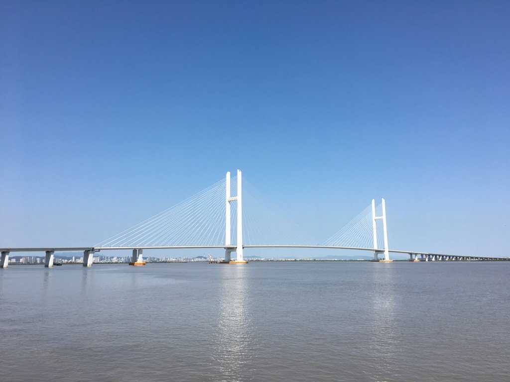 Kim Jong Un enters China via newly opened Yalu bridge on first visit in over a year, Seoul says